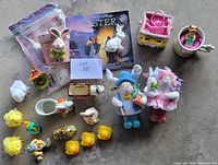 Overview of all Easter-themed items including bunnies, chicks, ducks, basket, mug, music box, and Easter book.