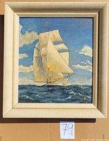 Front view of the framed acrylic painting depicting a sailboat at sea under a partly cloudy sky.