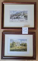 Wooden framed prints of Whistler ski slope winter scene and Braemar Castle in daylight, hung or displayed side by side.