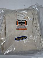 New Cherokee painting pants in original sealed plastic bag with label showing size 32x32 and 100% cotton composition.