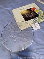 Clear round glass serving dish with etched floral motif and box with Wiesengrund branding, lot tag number 22.