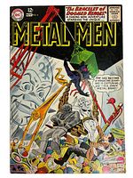 Front cover of Metal Men comic book Nov. No. 4 showing the classic Silver Age comic art with a giant metal band capturing characters.