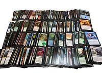 Spread of hundreds of Magic The Gathering cards laid out showing a large portion of the lot.