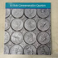 Front cover of 50 State Commemorative Quarters album showing a collage of quarter images.