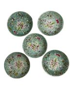 Top view of 5 porcelain dishes arranged in circular pattern showing floral and butterfly decorations.