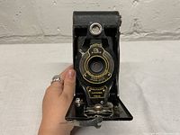 Front view of Kodak 2A camera showing Ektar lens and front bellows.