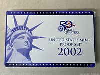 United States Mint Proof Set 2002 outer packaging showing Statue of Liberty image and set title.