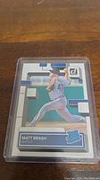Front of Matt Brash rookie baseball card in protective plastic sleeve, showing the player pitching for Seattle Mariners, with Donruss branding and Rated Rookie logo