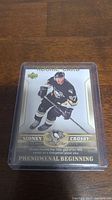 Sidney Crosby rookie hockey card, featuring Crosby in Pittsburgh Penguins uniform, numbered 87/C, in a clear protective sleeve.