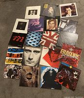 Lot of 20 vinyl records spread out on carpet showing album covers and titles including Erasure and Robert Palmer.
