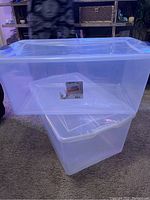 Photo showing the two stacked clear plastic storage containers with lids and Safelite branding on a label.