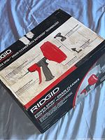 Box of Ridgid Power Spin drain cleaner showing its graphic and features.