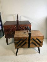 Pair of vintage wooden sewing boxes, darker and lighter wood tones, showing overall condition and size