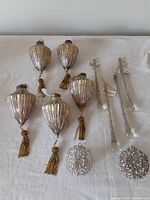 Top view of the full set showing the 5 mercury glass ornaments with tassels, 4 glass icicles, and 2 wire ball ornaments with faux pearls.