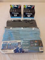 Photo showing two boxed Dr. Cool Ice + Compression Wraps and two hot & cold gel packs in packaging.