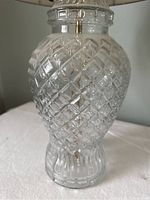 Close-up of clear glass lamp base with diamond pattern.