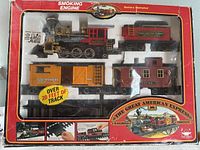 Front view of the boxed Great American Express train set showing all contents inside plastic window.