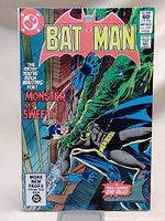 Front cover of Batman #344 comic showing Batman being grabbed by a green monster, with colorful bold text and DC logo.
