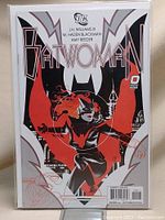 Front cover of Batwoman #1 comic book in bag and board, showing the full cover art and credits.