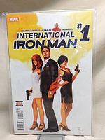 Front cover of International Iron Man #1 comic book with Marvel logo and characters shown on cover.