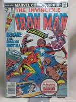 Front cover showing Iron Man fighting the Blood Brothers inside the Lincoln Tunnel with text warnings and titles.