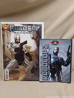 Full view of Robocop 1 comic book and Robocop 2 DVD side by side