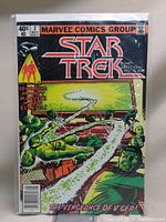 Front cover view of Star Trek comic book issue #2 with bright colors and title visible.