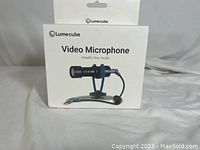 Front box showing Lume Cube Video Microphone product image and branding.
