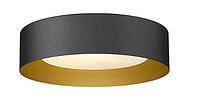 Photo of the modern flush mount ceiling light showing its black cylindrical shape with gold inner surface.