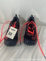 Front view of the pair of black and red Adidas trail running sneakers with visible laces and Adidas branding.