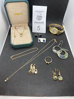 Green Mappins jewelry box with pearl bead necklace visible