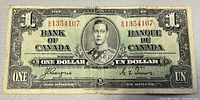 Obverse side of 1937 Canadian one dollar bill showing King George VI portrait with serial numbers and denomination text.