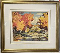 Framed print of autumnal country road with fall trees and rural background under sky