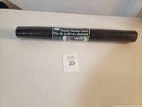 A single roll of black plastic garden mesh with label indicating 'Plastic Garden Mesh' and bilingual text.