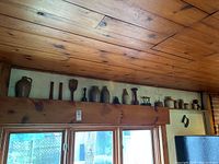 Overview of mixed collection arranged on a high wooden shelf