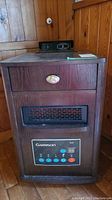 Front view of Garrison portable heater showing drawer, control panel with buttons and temperature display.