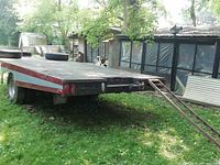 View of trailer deck and attached steel loading ramps