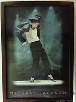 Front view of lenticular 3D poster showing Michael Jackson in mid-dance pose with hat tipped down, wearing signature outfit under spotlight smoke background.