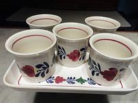Five Boerenbont egg cups on a melamine tray, showing overall set