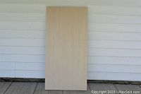 Front side of the IKEA Linmon table top showing smooth birch veneer surface.