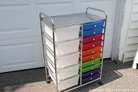 Front left side view of the 15 drawer rolling cart showing colorful drawers and chrome frame.