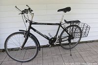 Side view of Renegade mountain bike showing steel frame, rear rack, rear fender, kickstand, and front tire.