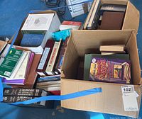 Four boxes containing assorted medical and health literature and books, various sizes and conditions.