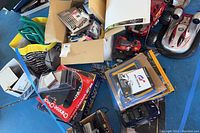 Overview of assorted toys and games including boxed items, card game decks, and other miscellaneous toy items.