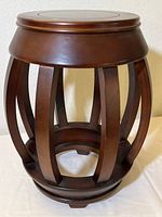 Front and side view of the solid wood pedestal showing the curved vertical slats and round top surface with inset circle.