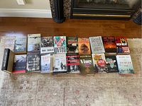 Photo shows 20 war history books arranged on floor, titles visible and readable, includes Antomy Beevor titles, Margaret MacMillan, Paul Theroux among others