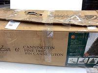 Cardboard box for 6' lighted Cannington pine tree with label showing brand and model details.