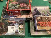Photo of puzzle boxes showing different artwork and piece counts