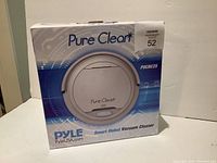 Original packaging box showing the Pure Clear PUCRC25 smart robot vacuum cleaner branding and model details.