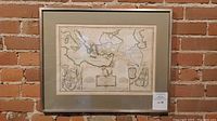 Framed full map of the Middle East on wall with brick background